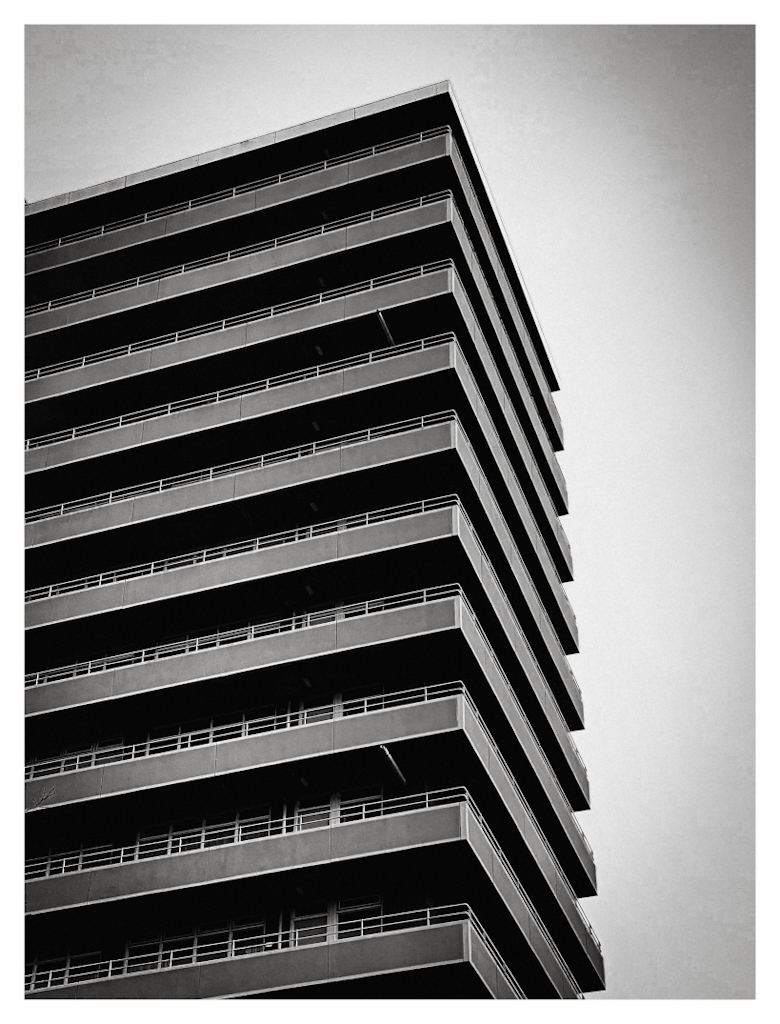 Apartment building featuring triangle shapes in black and white. 