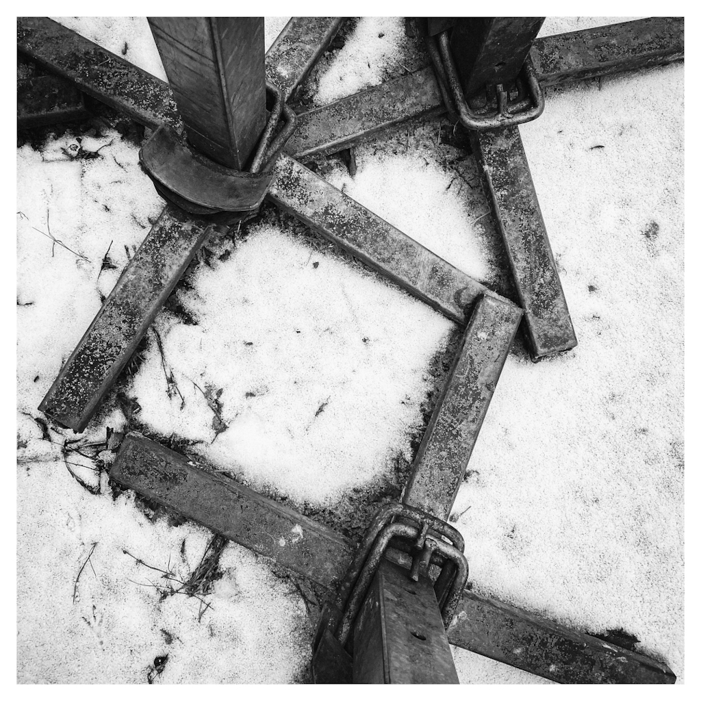 Metal stands shown from above, creating triangles and square patterns in snow.  