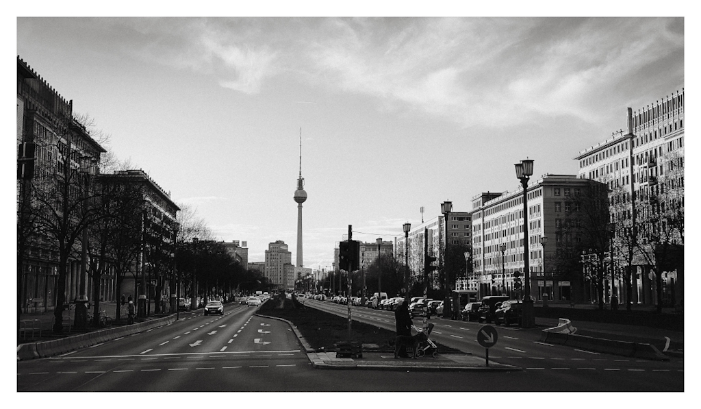 The broad Karl-Marx-Allee in Berlin, with the Fernsehturm in the background. 