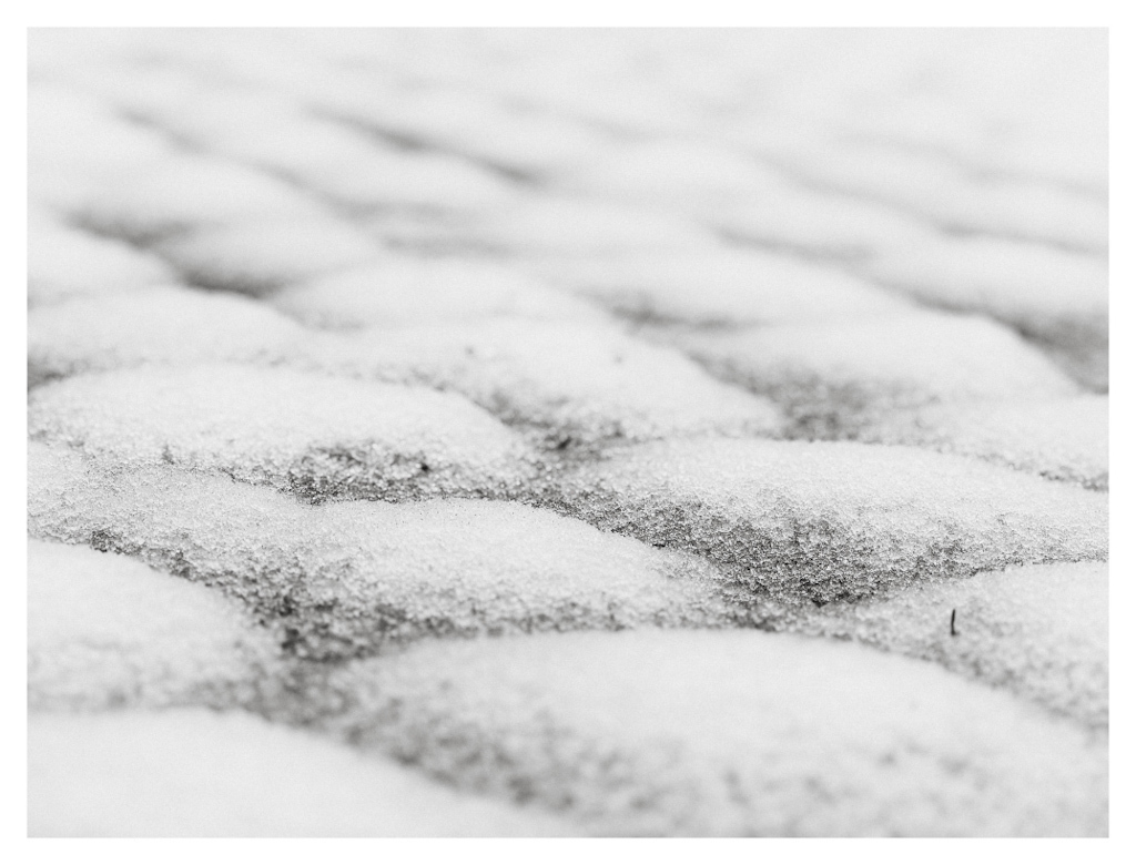 Regular pattern of hill shapes on a snowy road